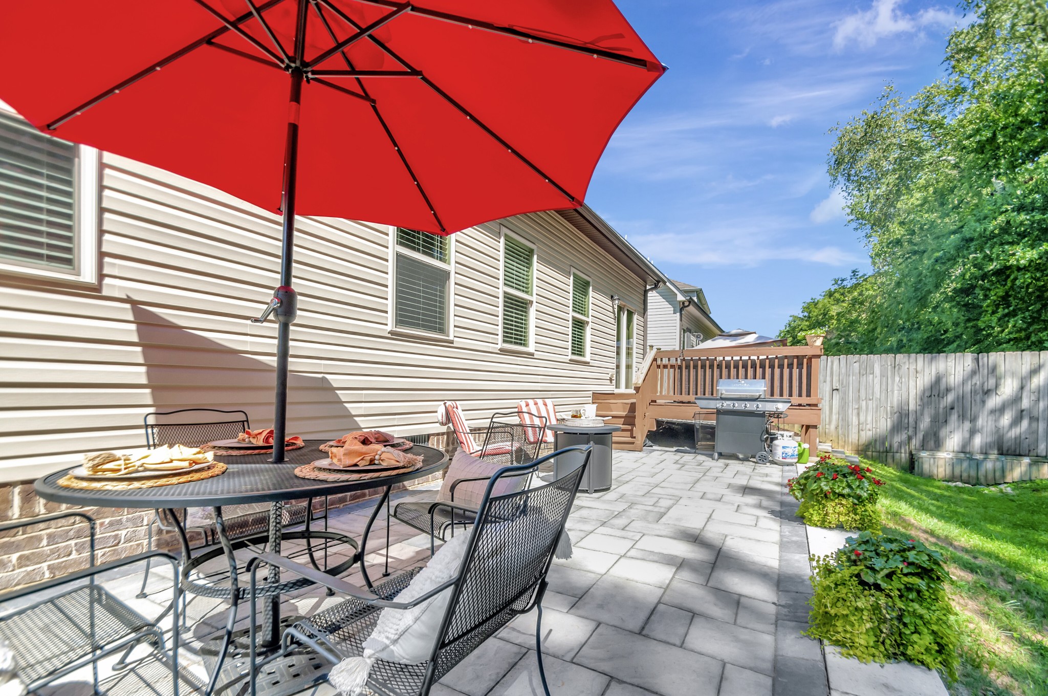 1118 Golf View Way Spring Hill, TN 37174 - Photo 24 of 30 a backyard of a house with table and chairs