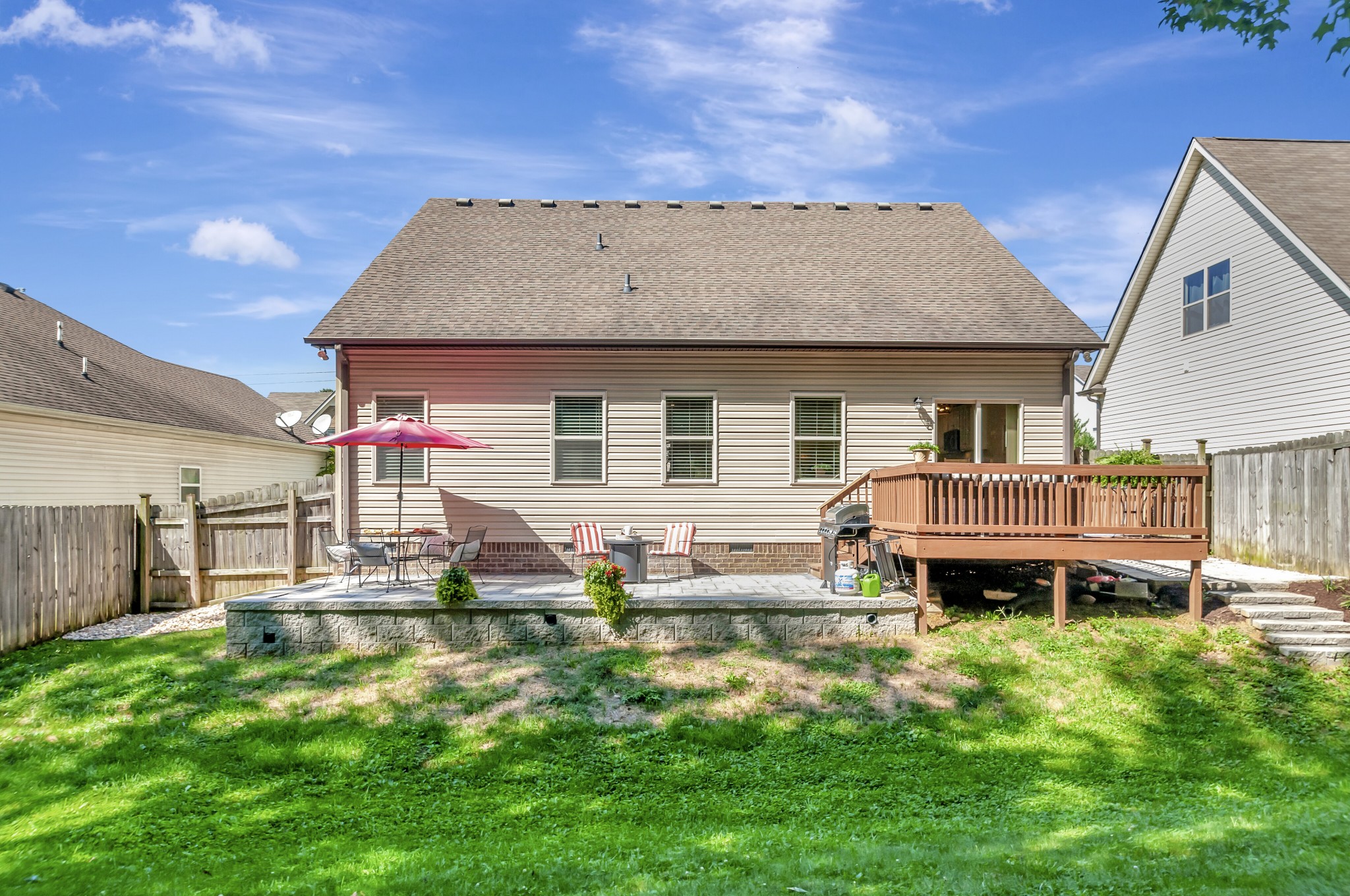 1118 Golf View Way Spring Hill, TN 37174 - Photo 28 of 30 a front view of a house with a yard table and chairs
