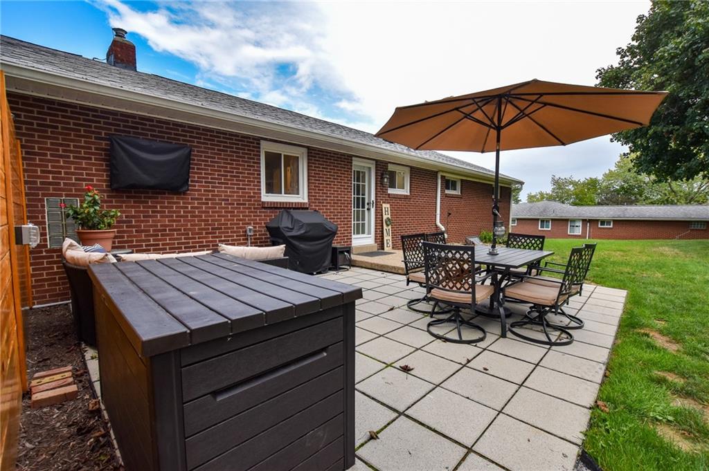 107 Cole Road Sarver, PA 16055 - Photo 21 of 21 a view of a roof deck with table and chairs under an umbrella