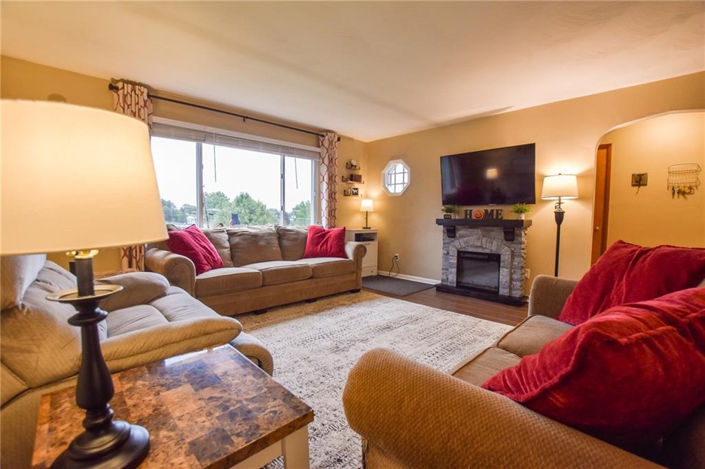107 Cole Road Sarver, PA 16055 - Photo 5 of 21 a living room with furniture a flat screen tv and a fireplace