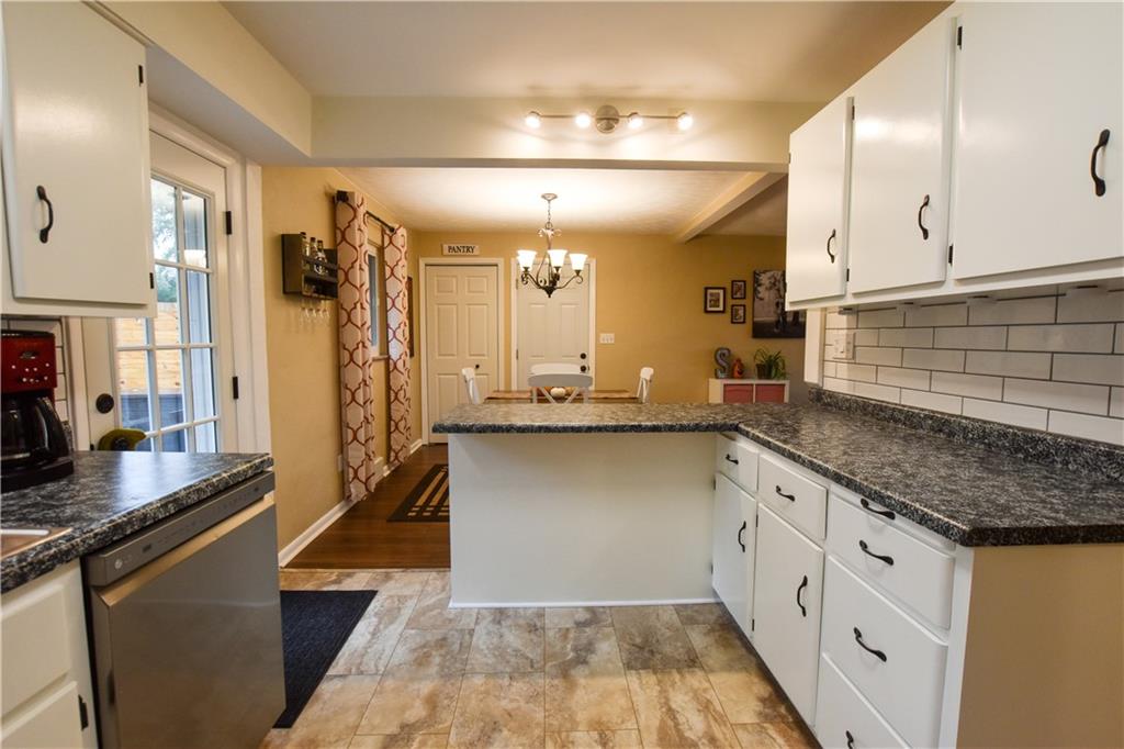 107 Cole Road Sarver, PA 16055 - Photo 9 of 21 a kitchen with stainless steel appliances granite countertop a sink and a refrigerator