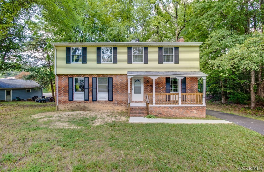 front view of a house with a yard