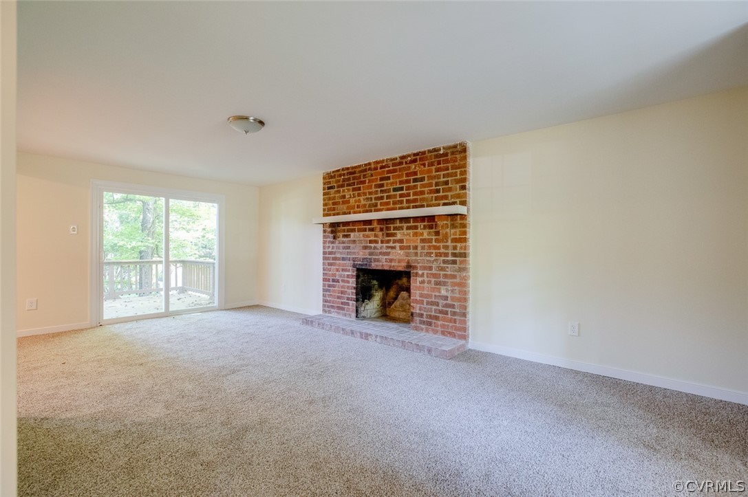 9302 Radborne Road Chesterfield, VA 23236 - Photo 11 of 48 a view of an empty room with a window and fireplace