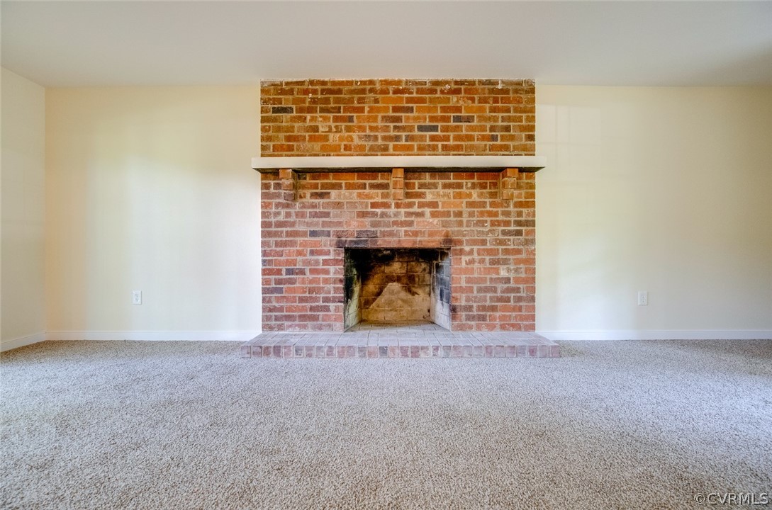 9302 Radborne Road Chesterfield, VA 23236 - Photo 12 of 48 a view of an empty room with a fireplace
