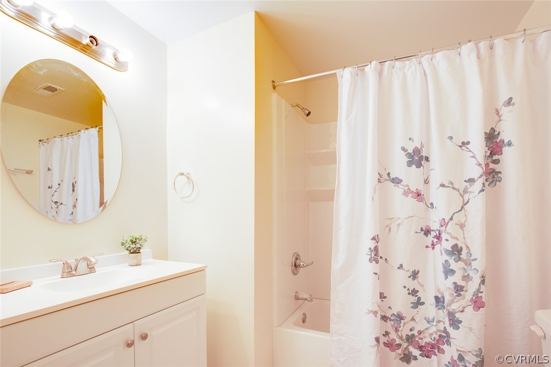 9302 Radborne Road Chesterfield, VA 23236 - Photo 25 of 48 a bathroom with a sink and a mirror