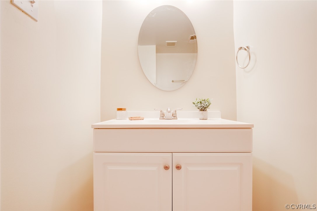 9302 Radborne Road Chesterfield, VA 23236 - Photo 27 of 48 a bathroom with a sink and a mirror