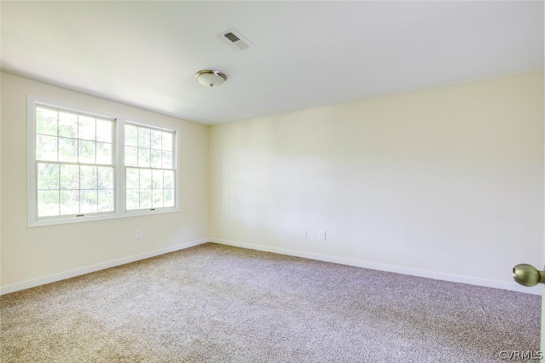9302 Radborne Road Chesterfield, VA 23236 - Photo 28 of 48 an empty room with a empty space and windows