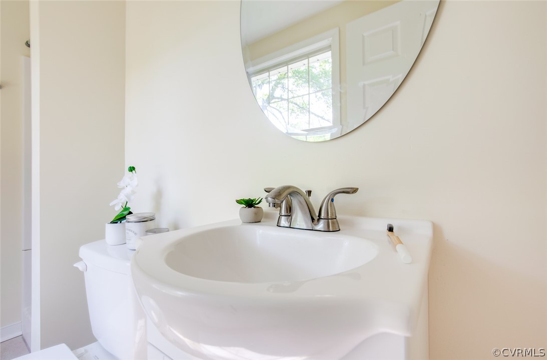 9302 Radborne Road Chesterfield, VA 23236 - Photo 33 of 48 a bathroom with a sink and a mirror