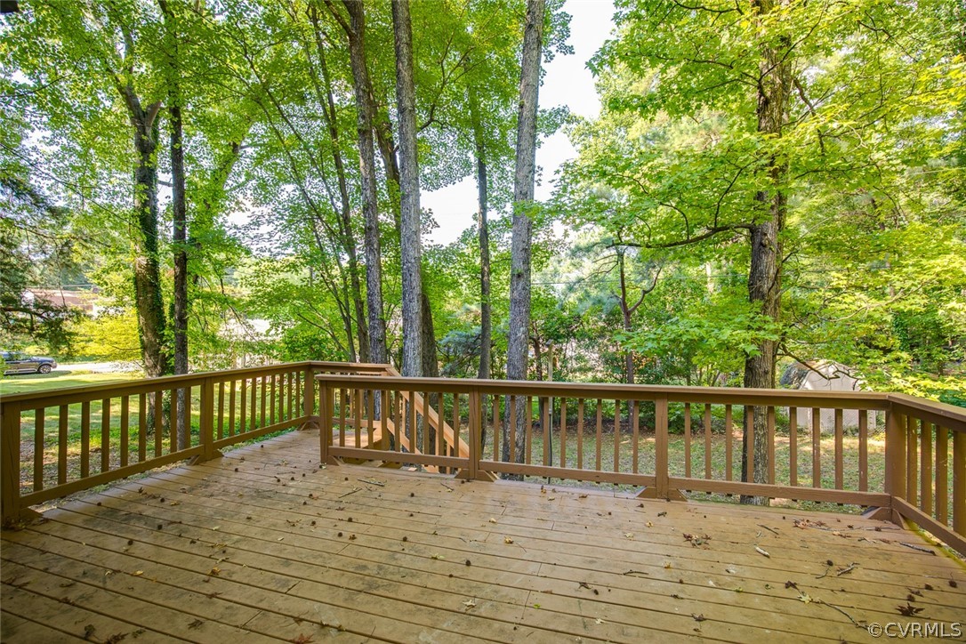 9302 Radborne Road Chesterfield, VA 23236 - Photo 41 of 48 a view of wooden deck and lake with trees in the background