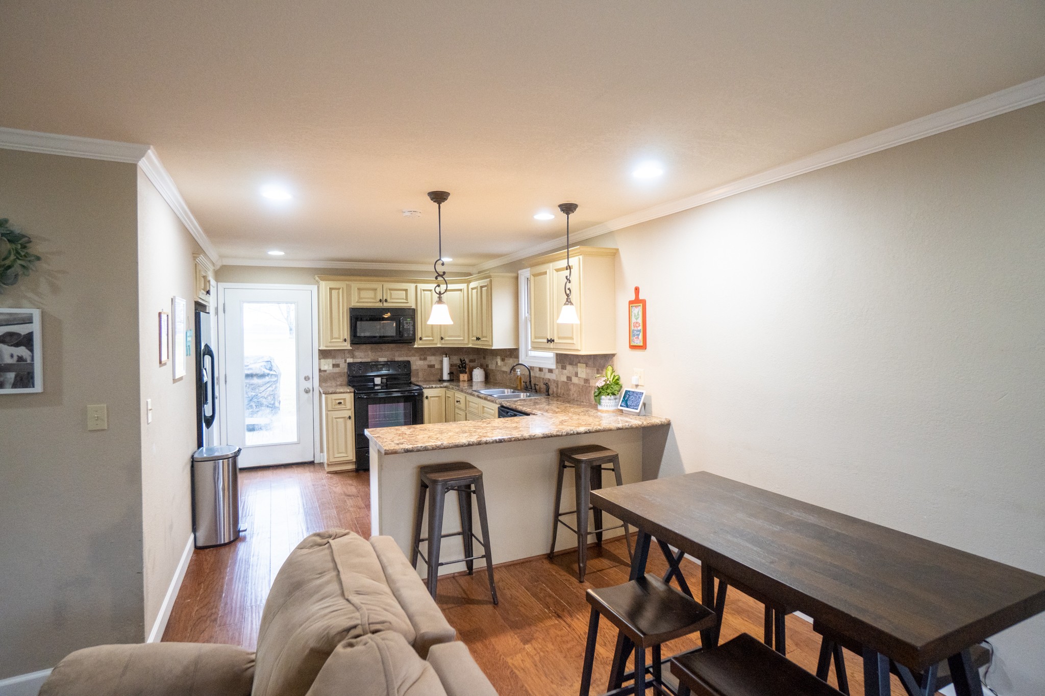 202 Airport Road Portland, TN 37148 - Photo 8 of 38 a living room with stainless steel appliances furniture a dining table and kitchen view