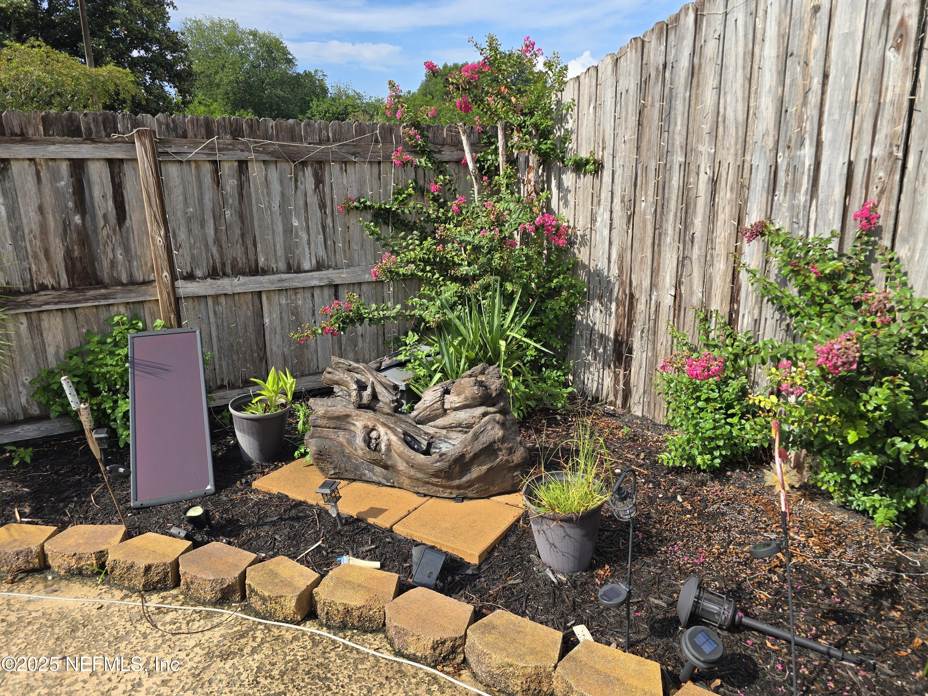 6051 Foxfire Court Jacksonville, FL 32244 - Photo 23 of 31 a wooden fence with some plants