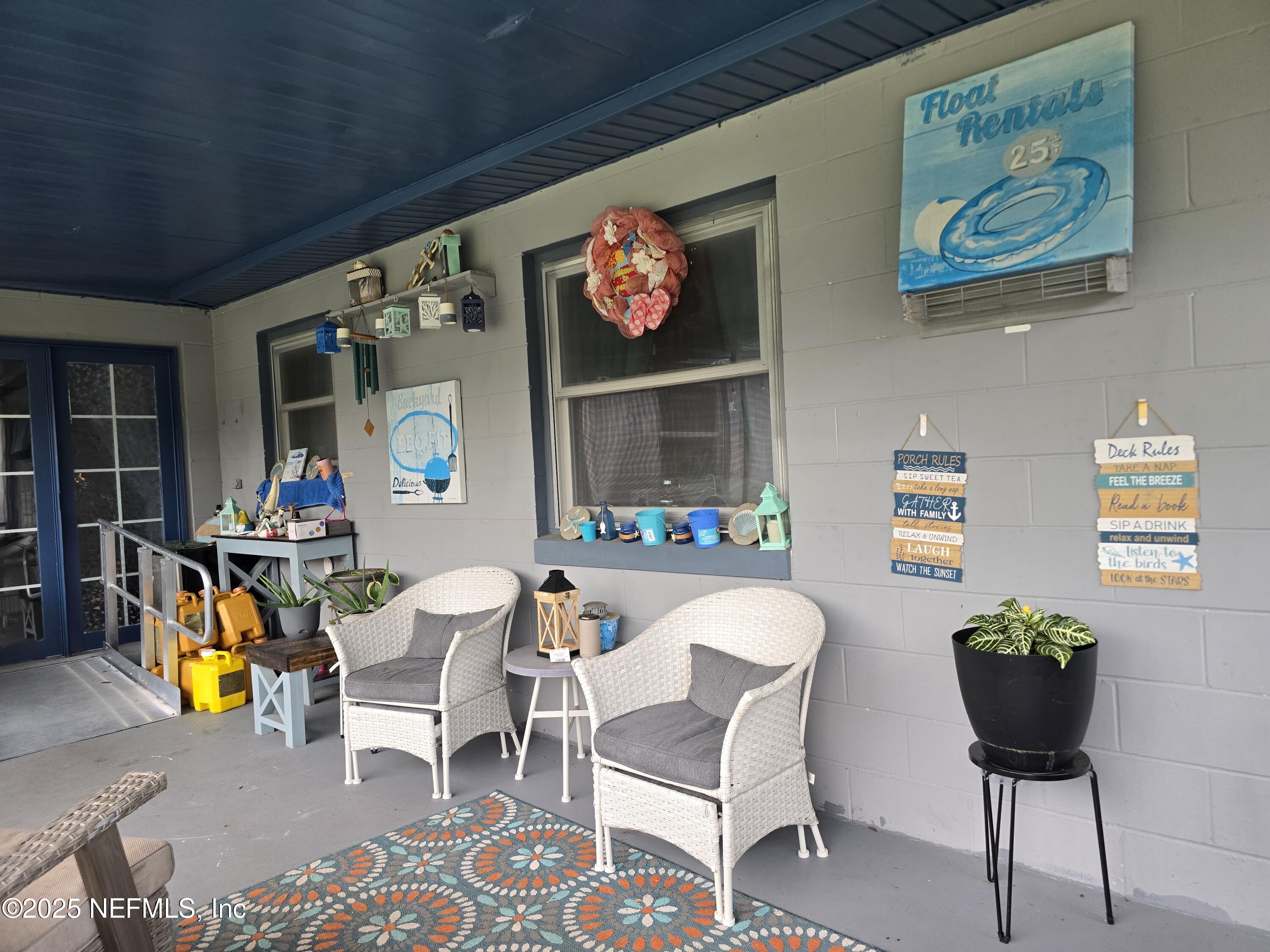 6051 Foxfire Court Jacksonville, FL 32244 - Photo 24 of 31 a living room with furniture and a flat screen tv
