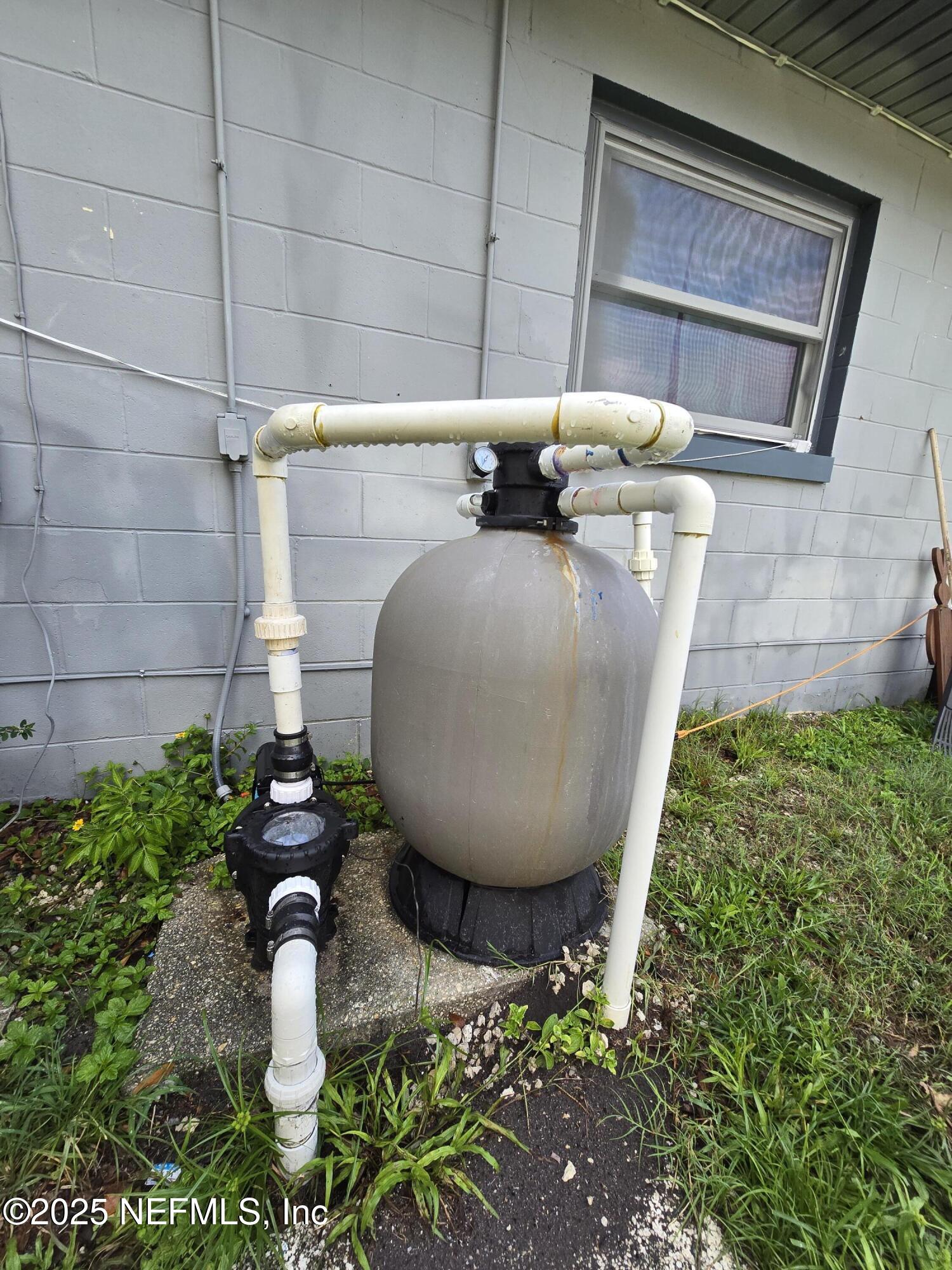 6051 Foxfire Court Jacksonville, FL 32244 - Photo 27 of 31 a view of a backyard with plants and a fountain