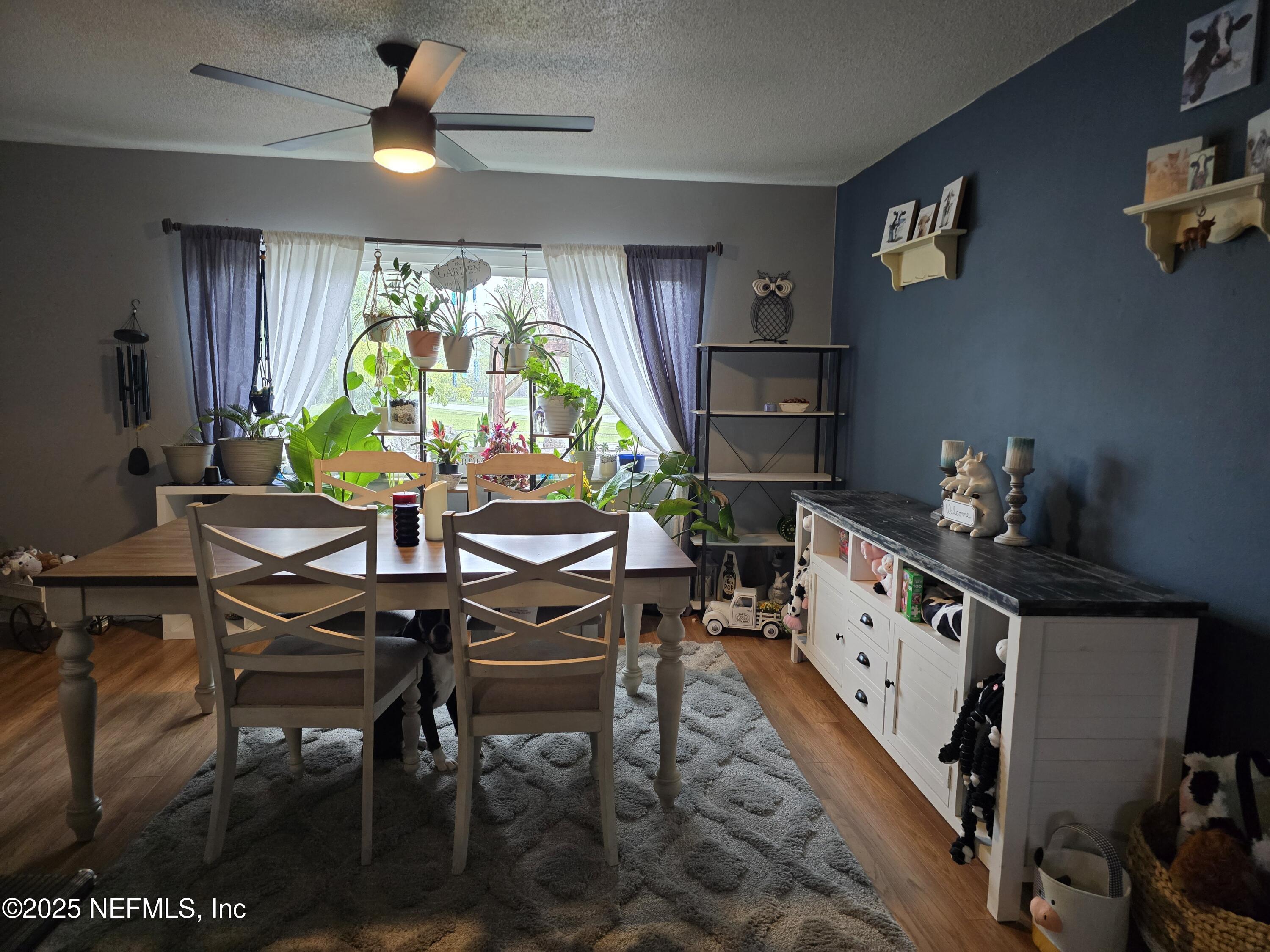 6051 Foxfire Court Jacksonville, FL 32244 - Photo 3 of 31 a view of a dining room with furniture window and wooden floor