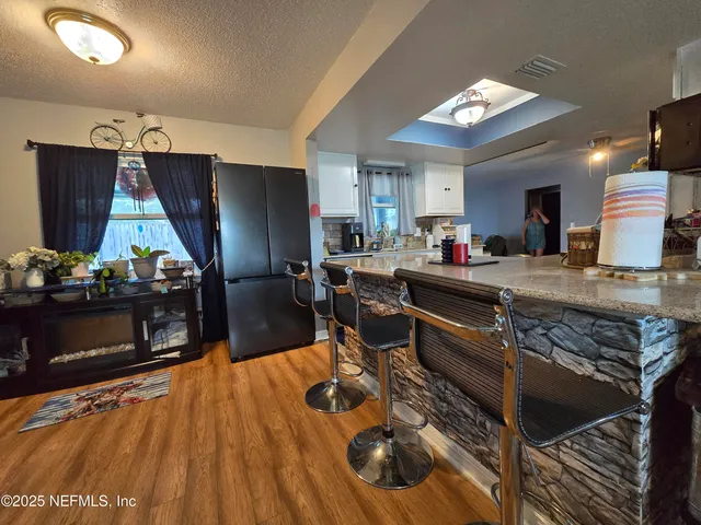 a bathroom with a toilet and a shower curtain