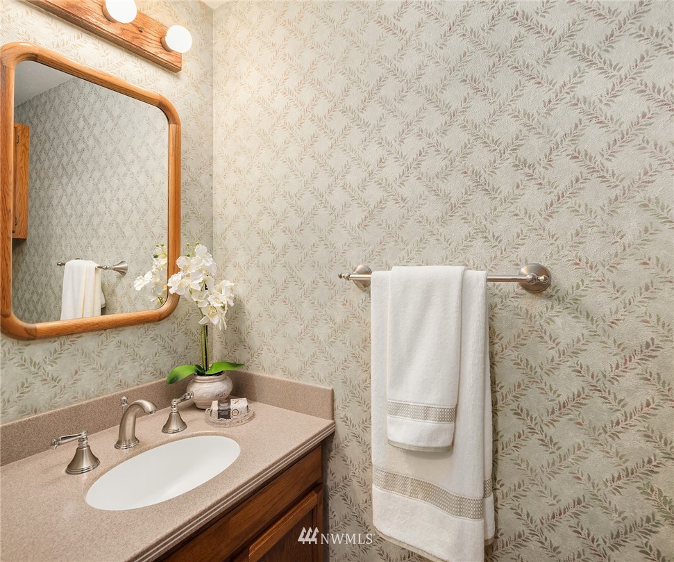 1133 South 23rd Street Renton, WA 98055 - Photo 17 of 38 a bathroom with a sink and a mirror