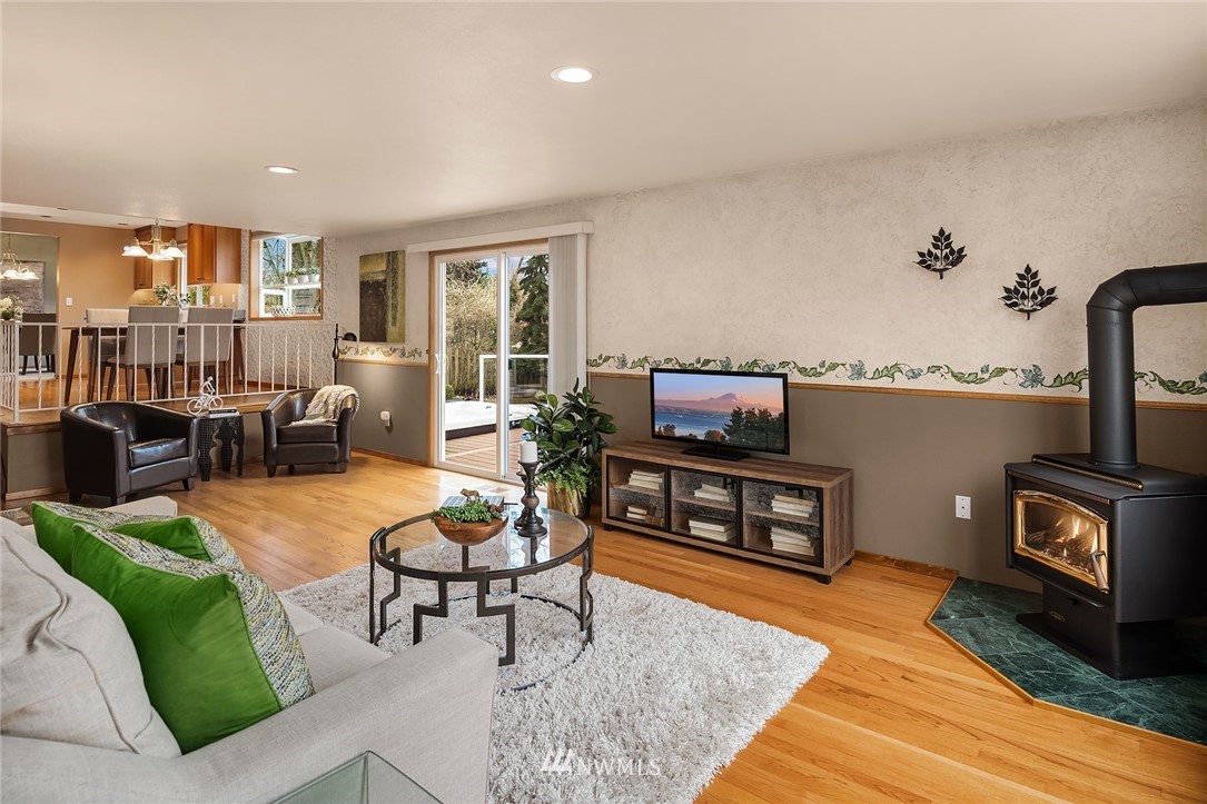 1133 South 23rd Street Renton, WA 98055 - Photo 19 of 38 a living room with furniture and a wooden floor
