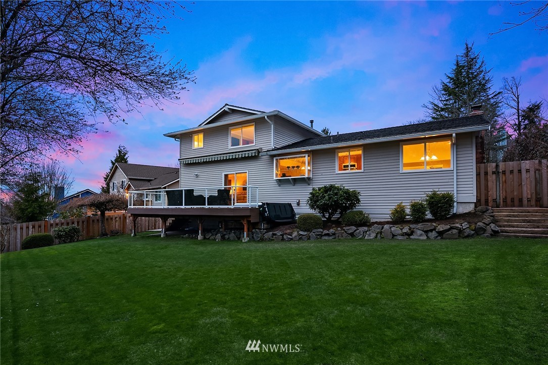 1133 South 23rd Street Renton, WA 98055 - Photo 28 of 38 a front view of a house with a big yard