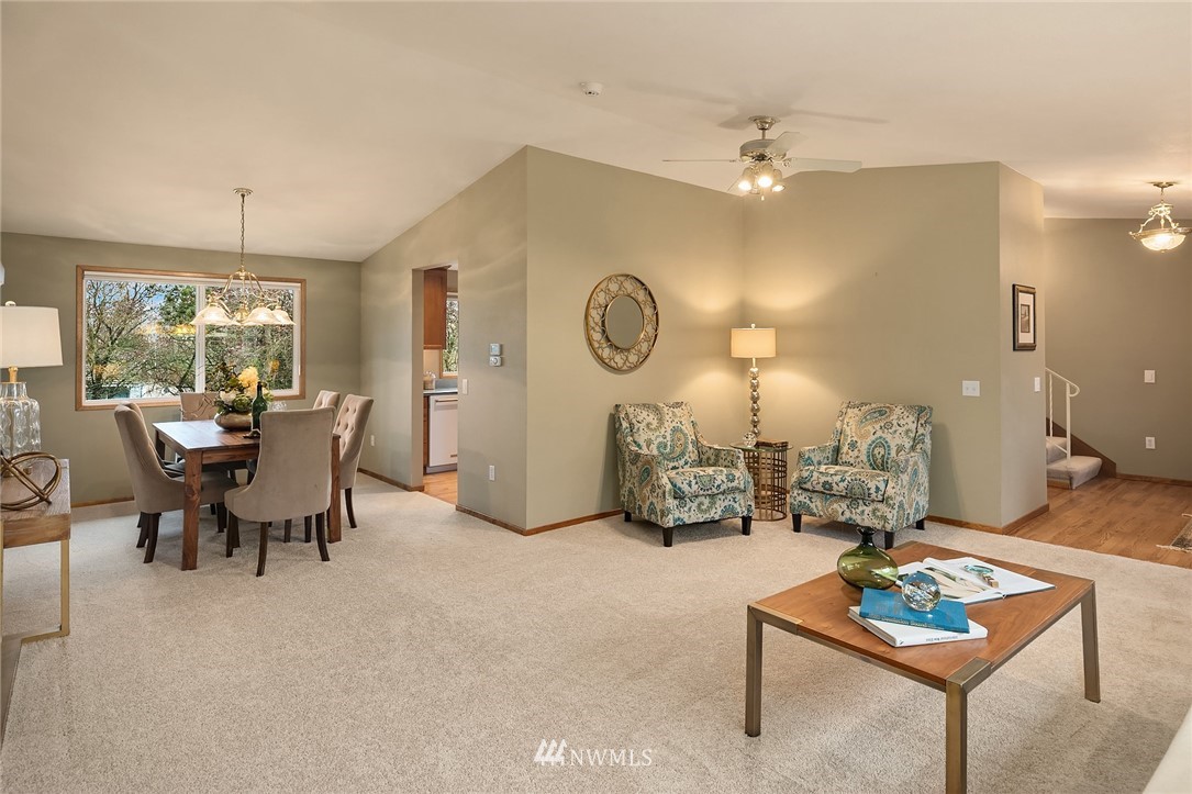 1133 South 23rd Street Renton, WA 98055 - Photo 7 of 38 a living room with furniture and a clock