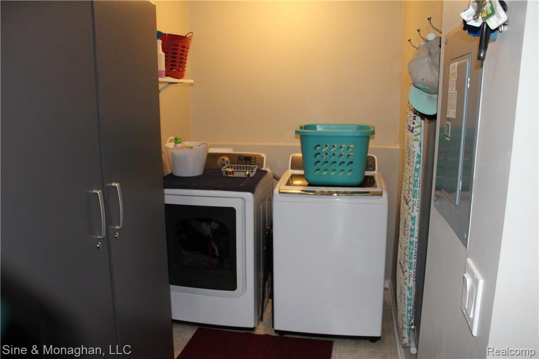 26523 Prinz Road Richmond, MI 48062 - Photo 16 of 61 LARGE LAUNDRY ROOM W/LARGE STORAGE CABINET (SELLER WILL LEAVE STORAGE CABINET W/HOME)