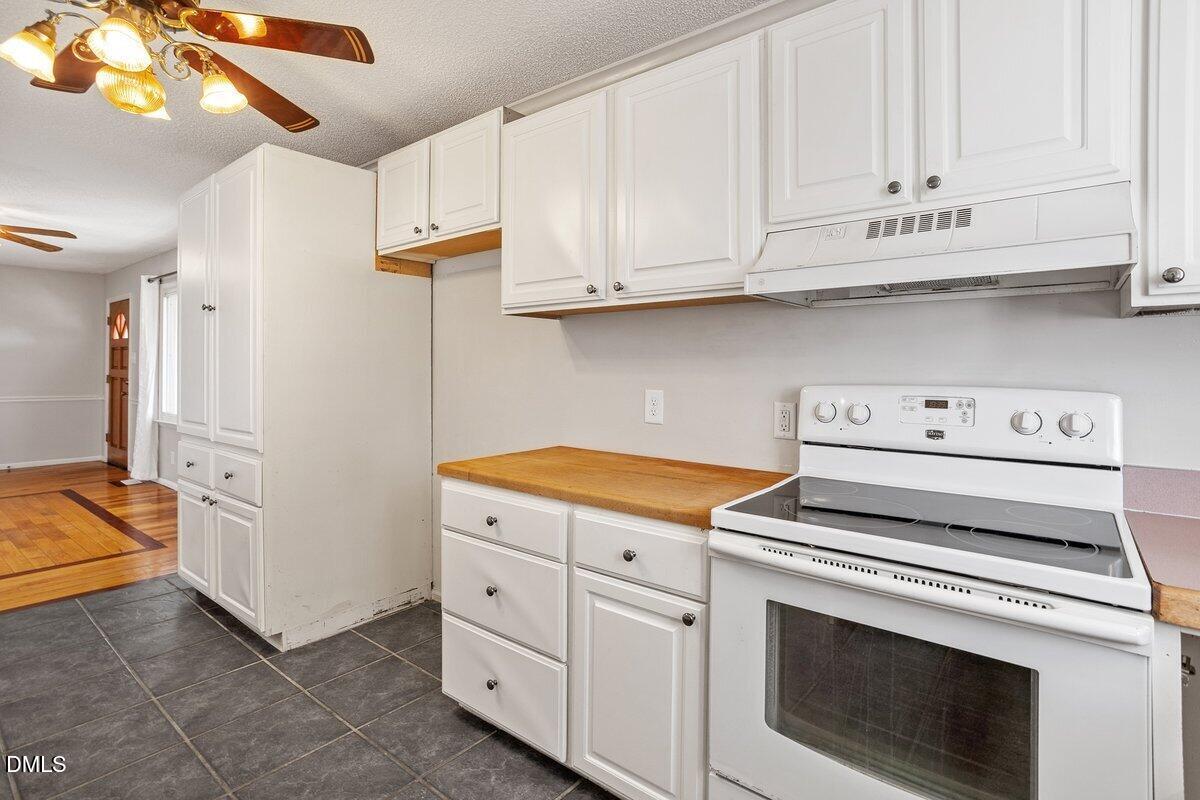 2 Howard Tant Road Zebulon, NC 27597 - Photo 11 of 34 Kitchen into Dining and Custom Pantry