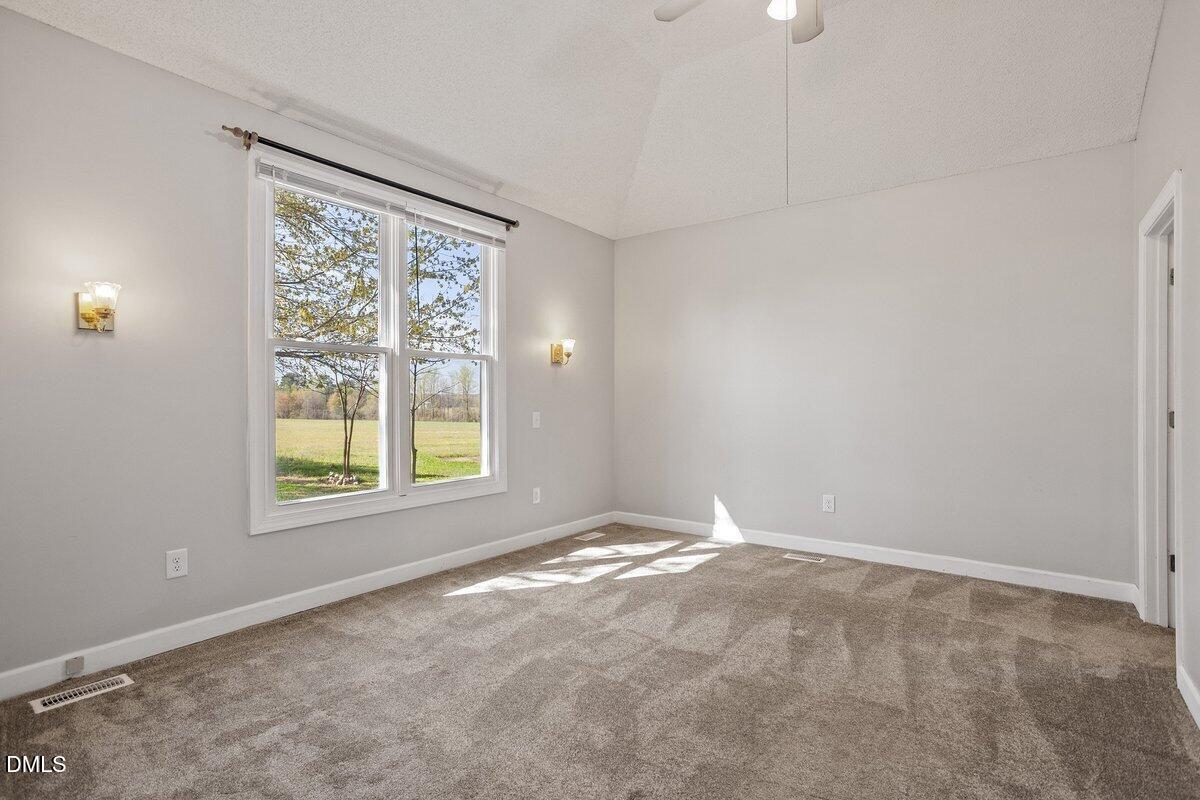 2 Howard Tant Road Zebulon, NC 27597 - Photo 16 of 34 Owners Bdrm From L.R. -View of Side Yard