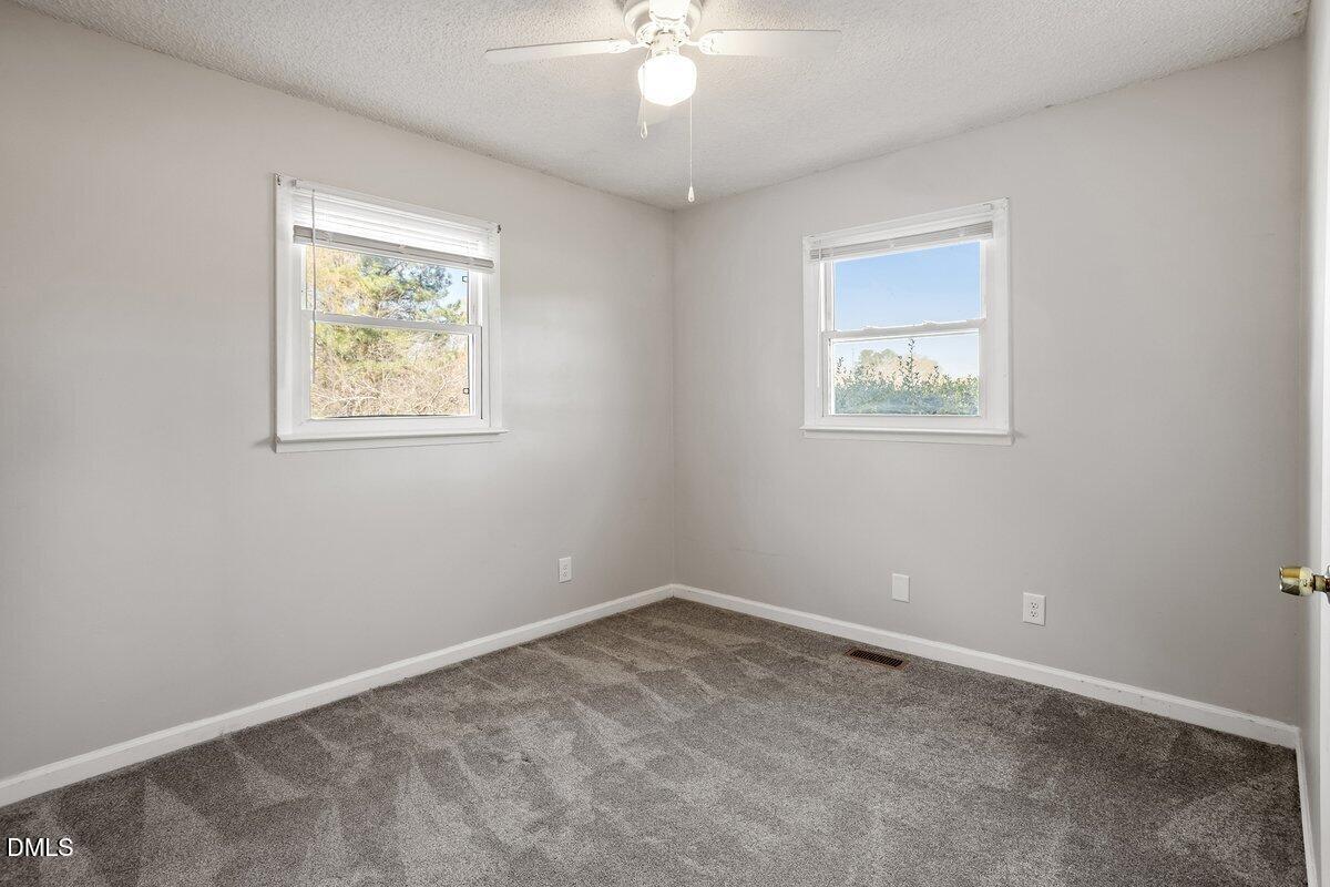 2 Howard Tant Road Zebulon, NC 27597 - Photo 22 of 34 Secondary Bdrm 2 @Rt Side/Rear/Driveway