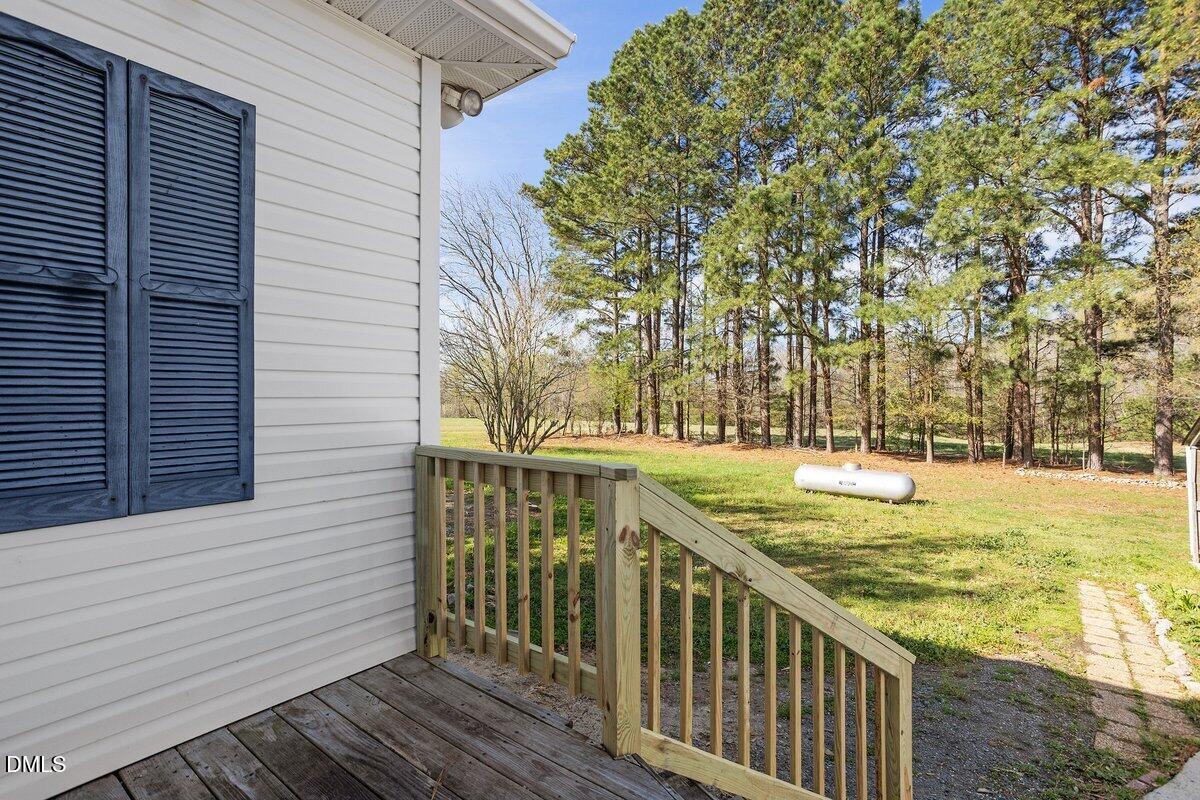 2 Howard Tant Road Zebulon, NC 27597 - Photo 31 of 34 View Rear Yard From Driveway Entry Door