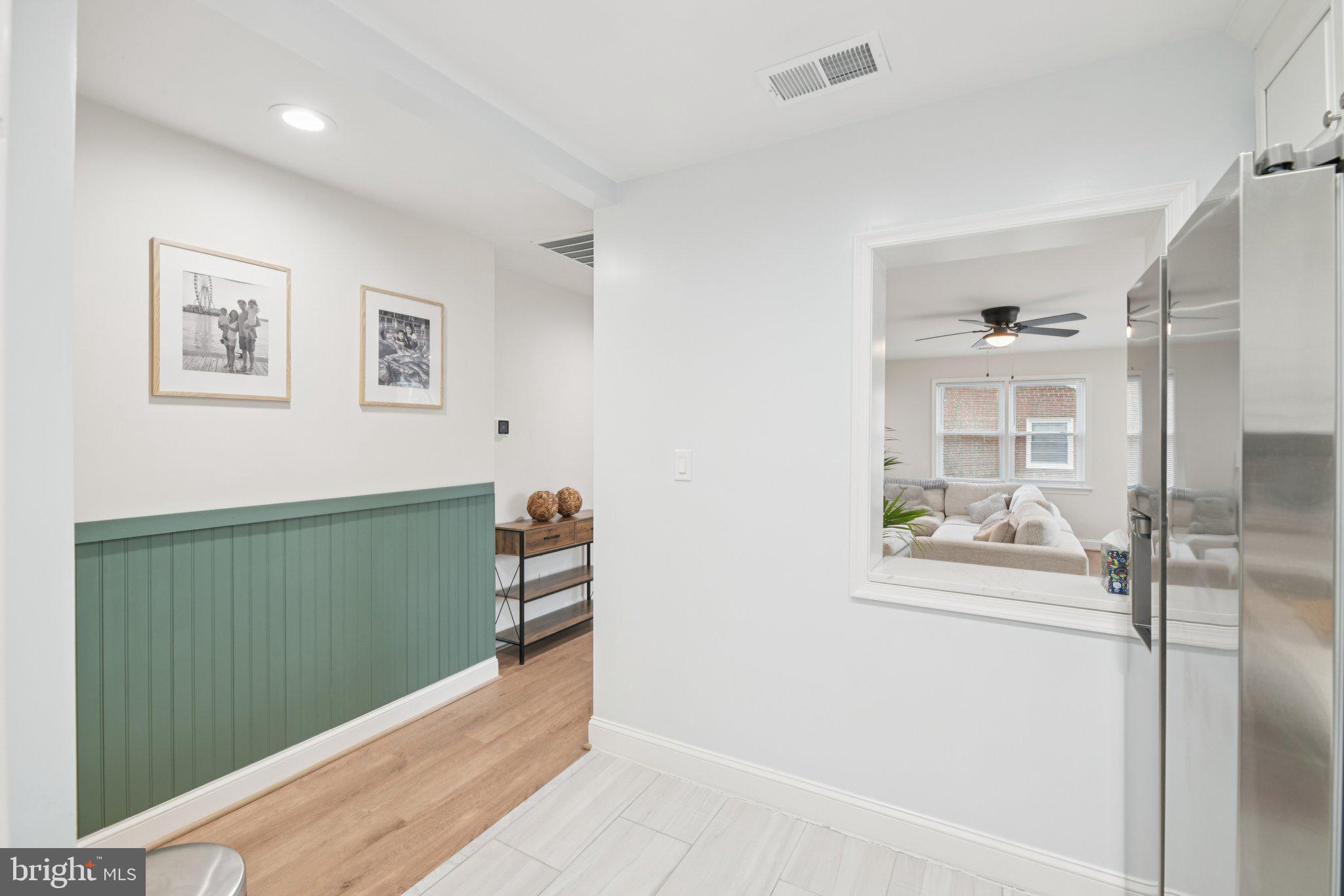 303 Foundry Lane Fort Washington, MD 20744 - Photo 11 of 43 a view of a hallway to a livingroom with furniture