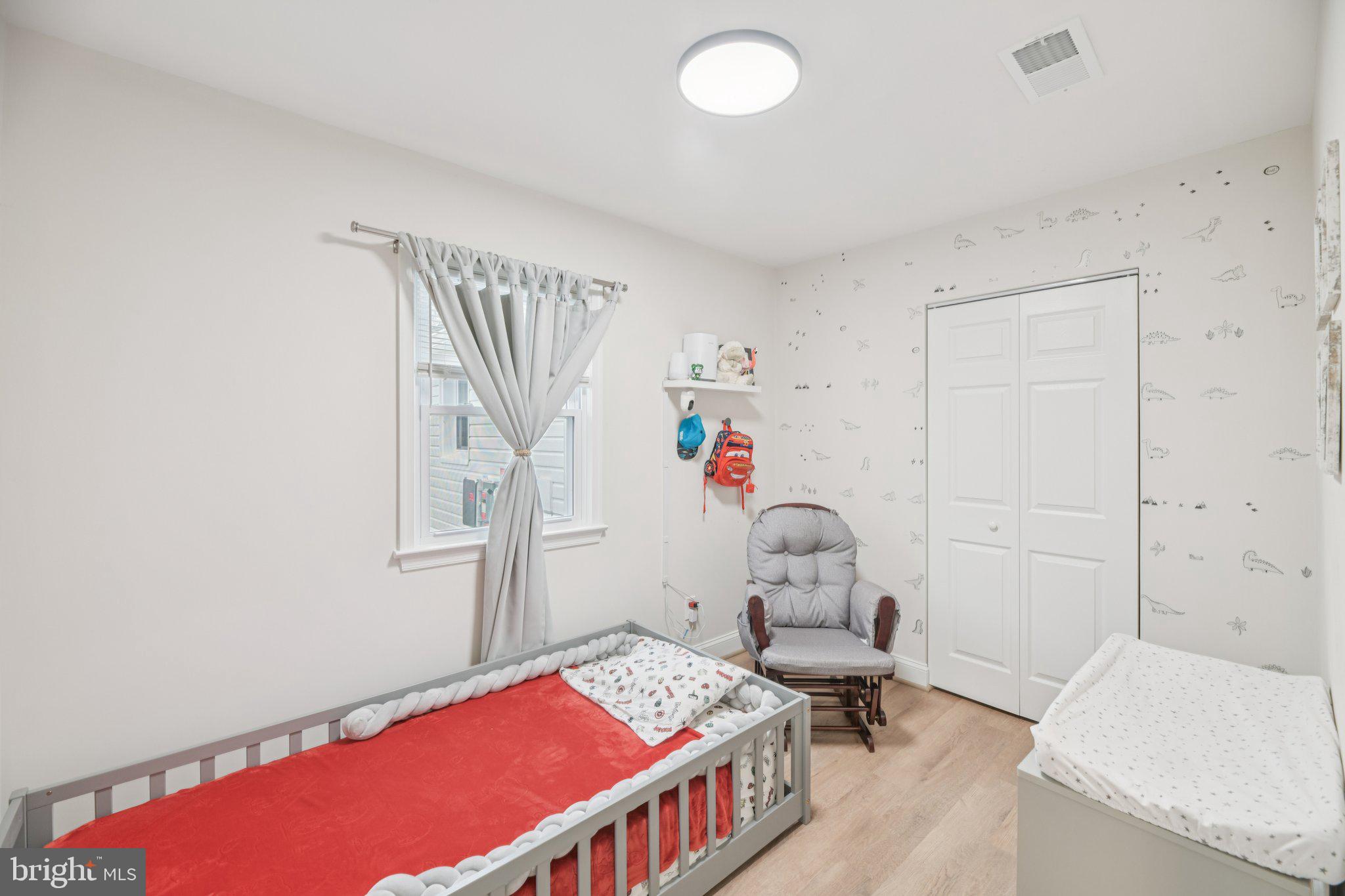 303 Foundry Lane Fort Washington, MD 20744 - Photo 13 of 43 a bedroom with a bed and a table in it