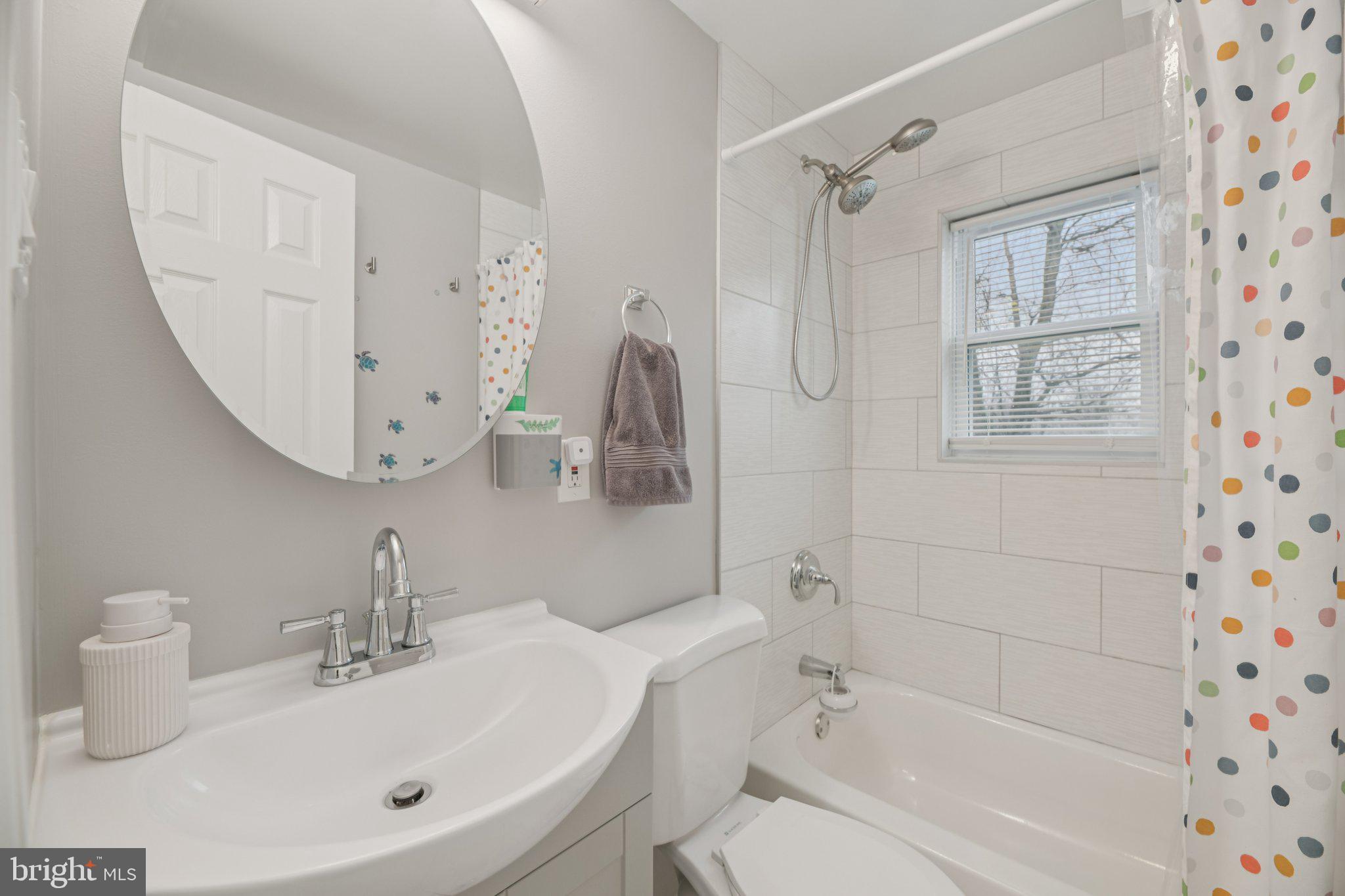 303 Foundry Lane Fort Washington, MD 20744 - Photo 15 of 43 a bathroom with a sink a toilet and shower