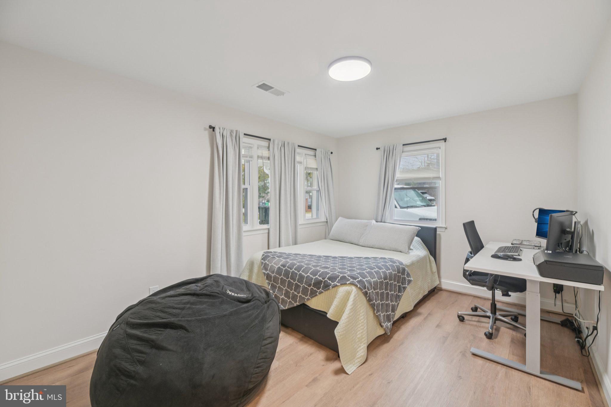 303 Foundry Lane Fort Washington, MD 20744 - Photo 16 of 43 a bedroom with a bed and a chair