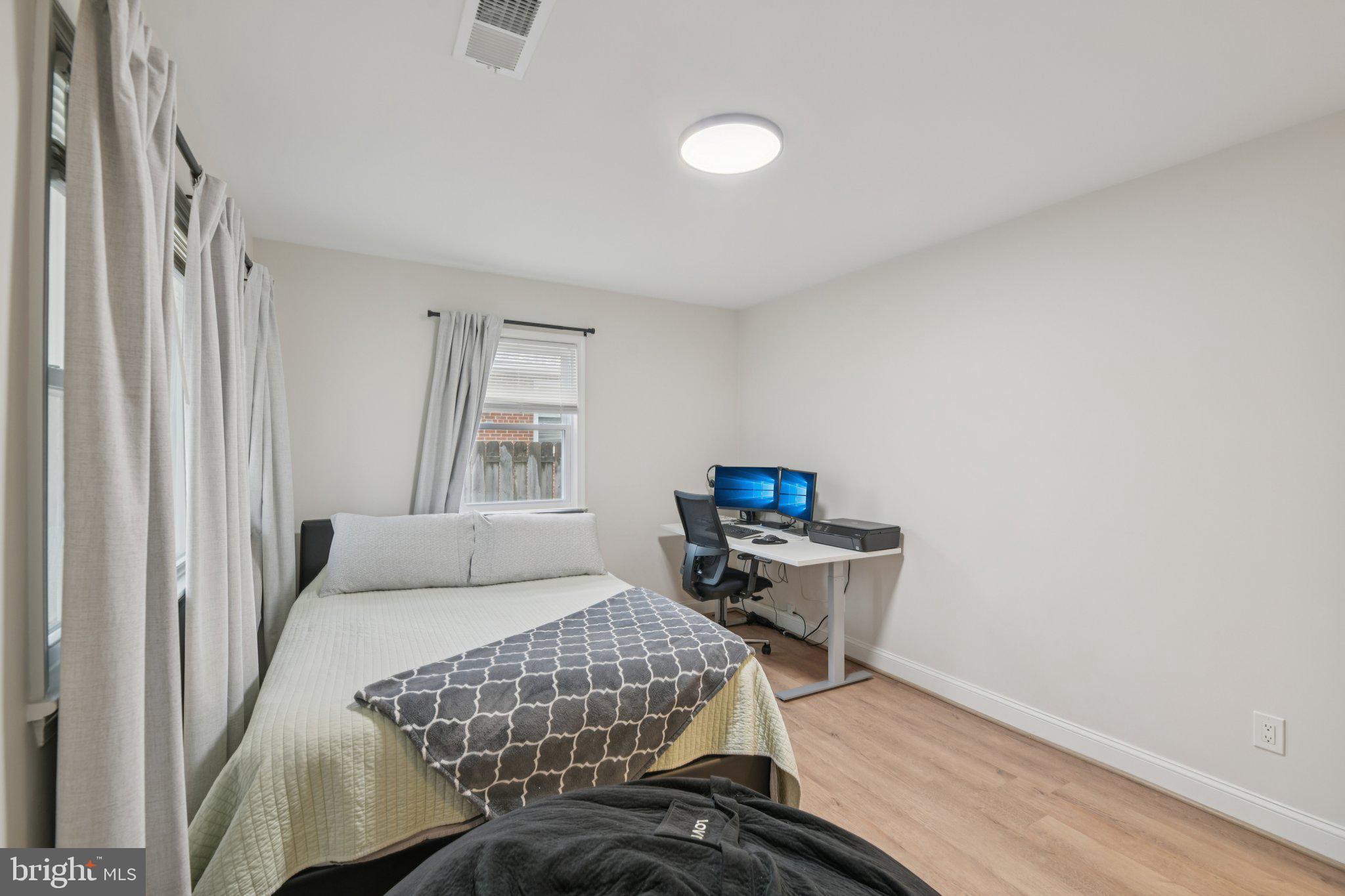 303 Foundry Lane Fort Washington, MD 20744 - Photo 18 of 43 a bedroom with a bed and chair