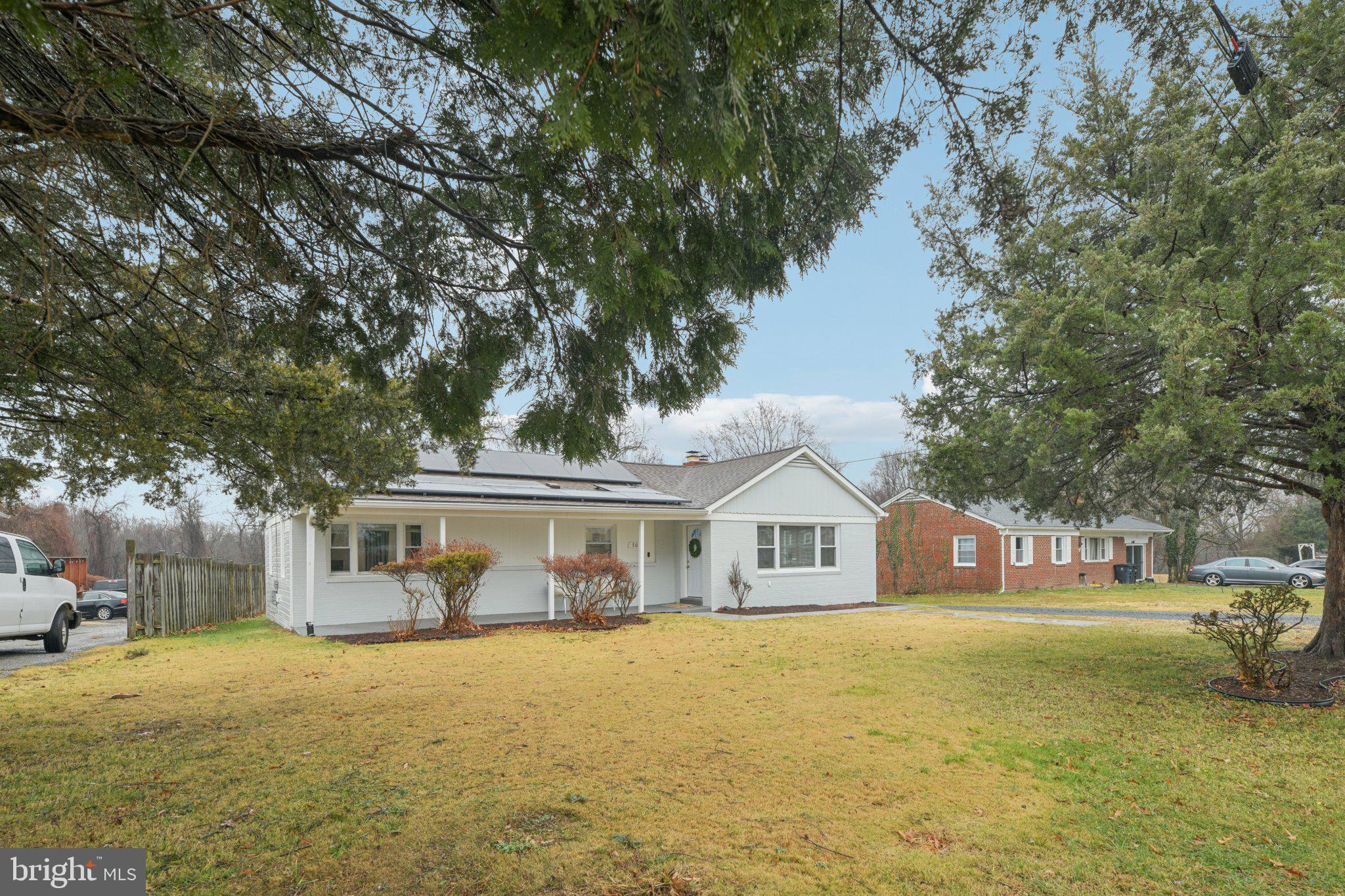 303 Foundry Lane Fort Washington, MD 20744 - Photo 2 of 43 a front view of a house with a yard