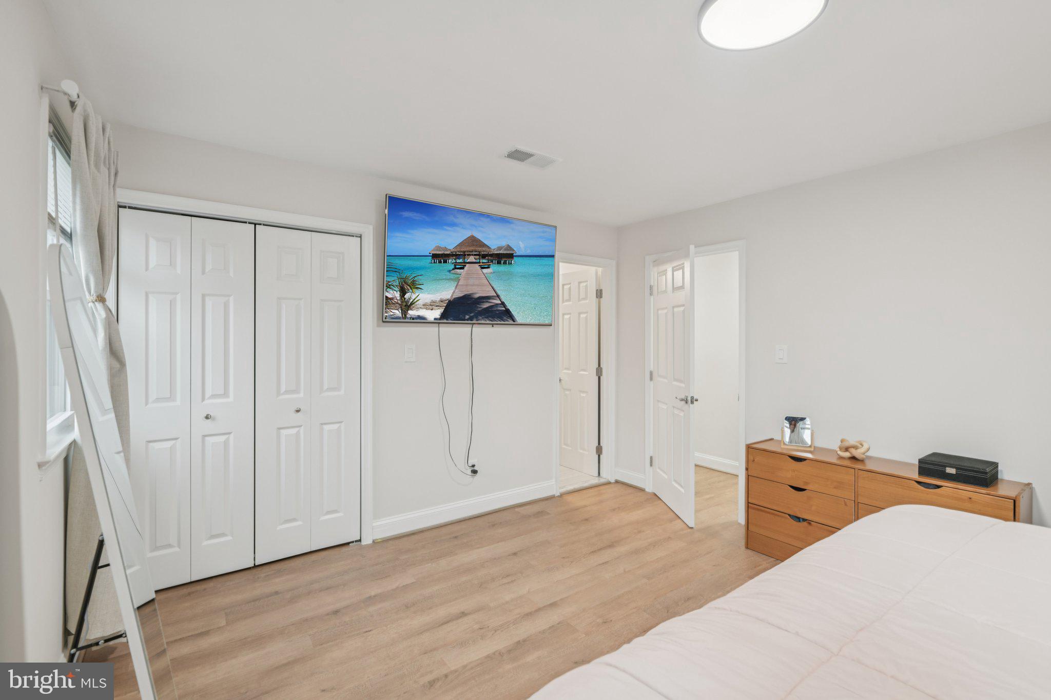 303 Foundry Lane Fort Washington, MD 20744 - Photo 25 of 43 a bedroom with a bed and a painting on the wall