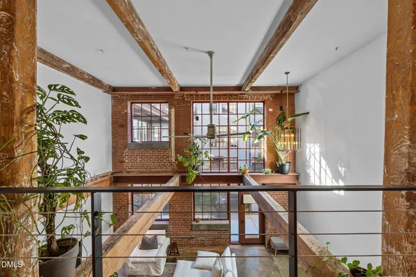 a view of entryway with a front door and wooden floor