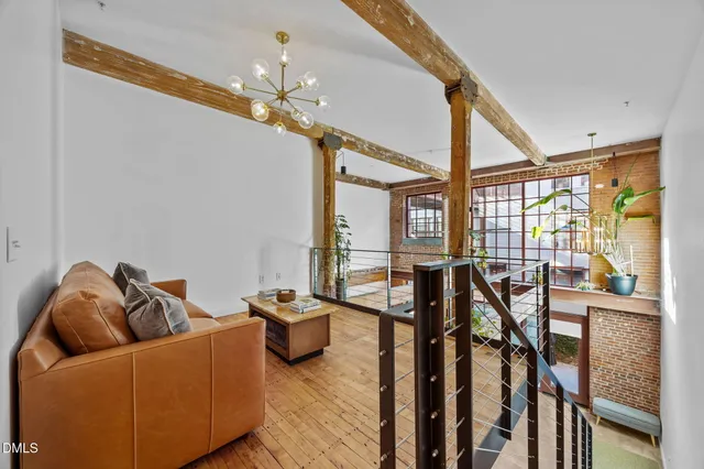 a bathroom with a granite countertop sink and a toilet