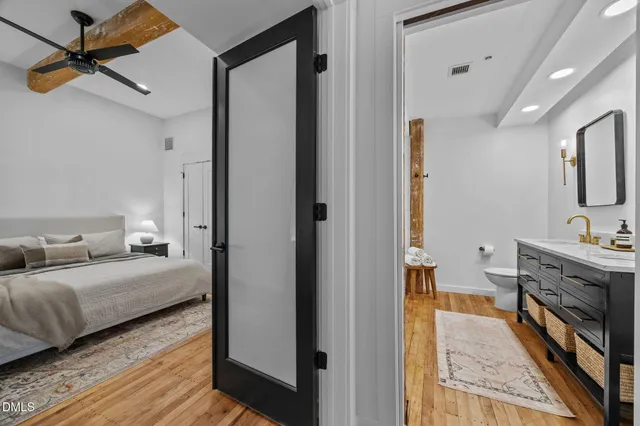 a view of a bedroom from a corridor