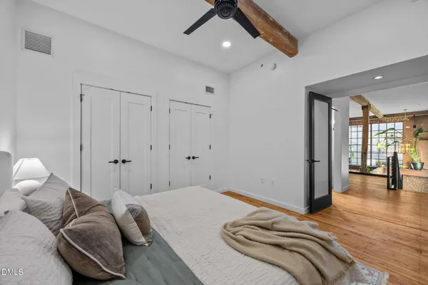 a bedroom with bed and window