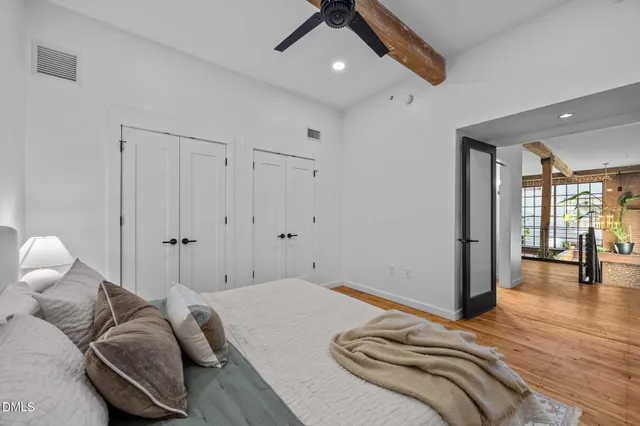 a bedroom with bed and window