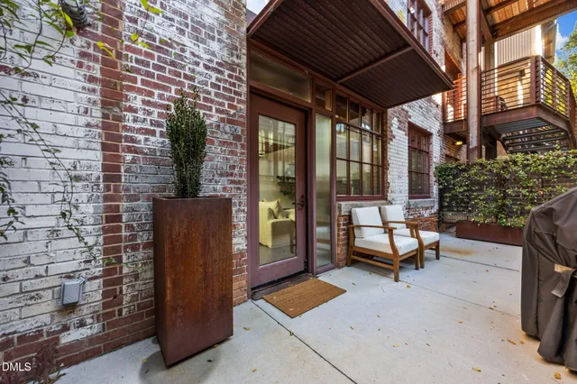 a bedroom with a bed and a large mirror