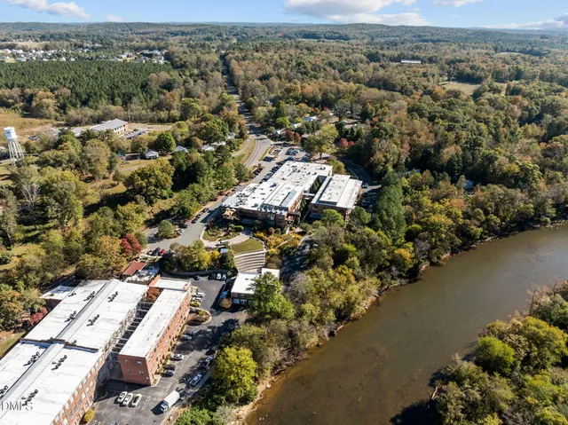 an aerial view of a city with ocean view