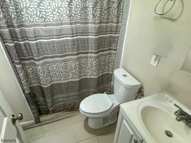 a bathroom with a toilet and a sink