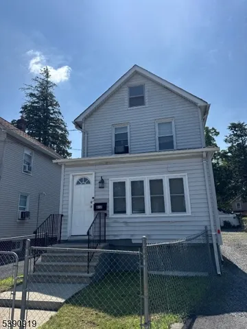 a front view of a house with stairs