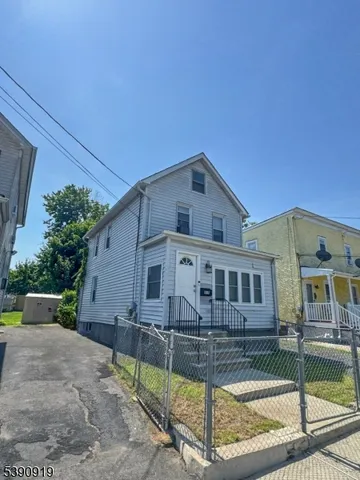 front view of a house with a small yard