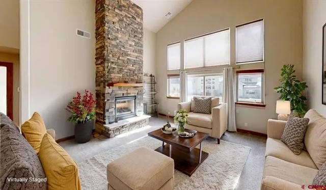 a living room with furniture or couch and a fireplace