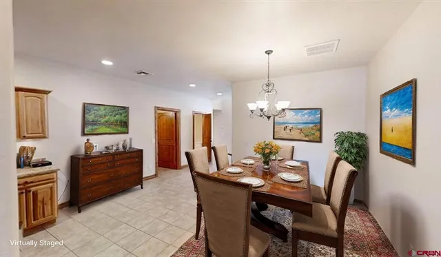 a dining room with furniture and window