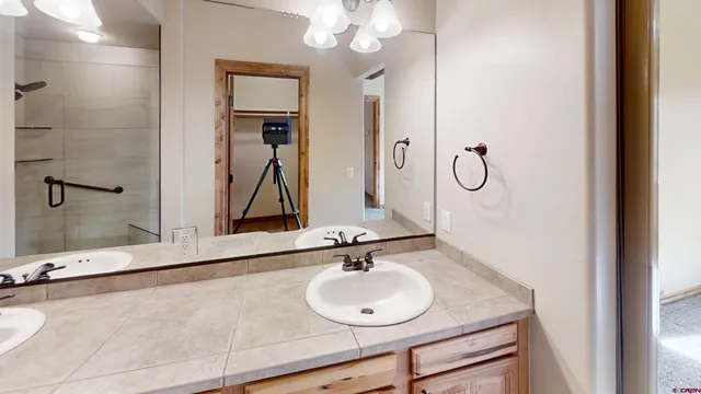 a bathroom with a sink and a mirror