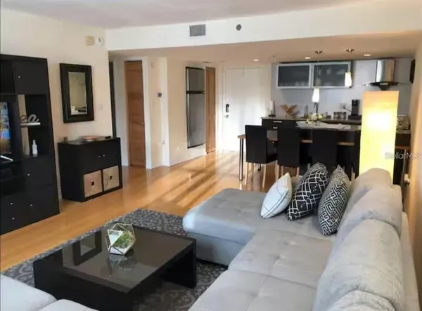a living room with furniture and a table