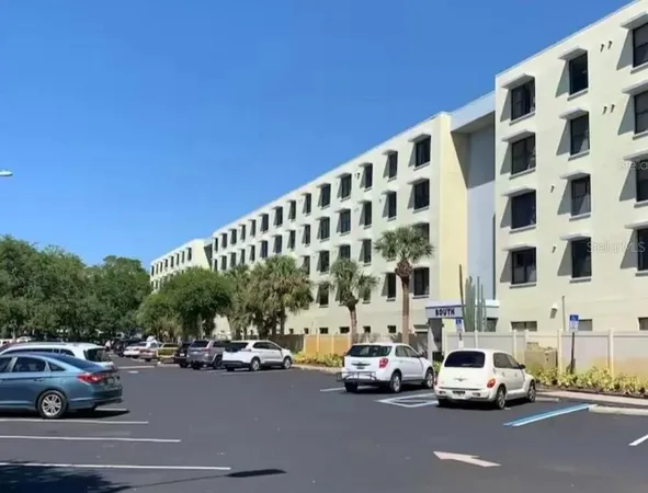 a view of a cars parked in front of a building